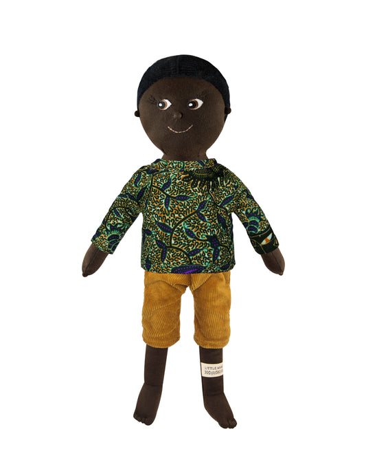 Kinderpuppe aus weichem Bio-Stoff, braun mit schwarzen Haaren und cord Hose.